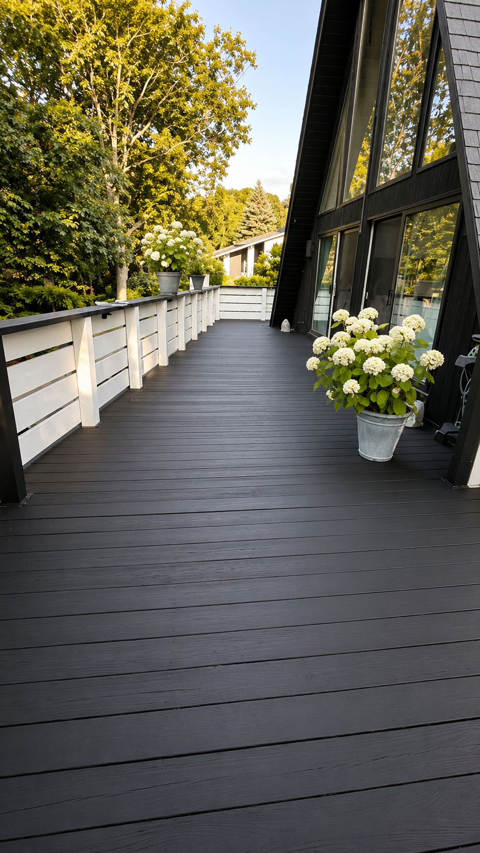 Backyard deck after washing and staining, with even color across the boards and clean railings.
