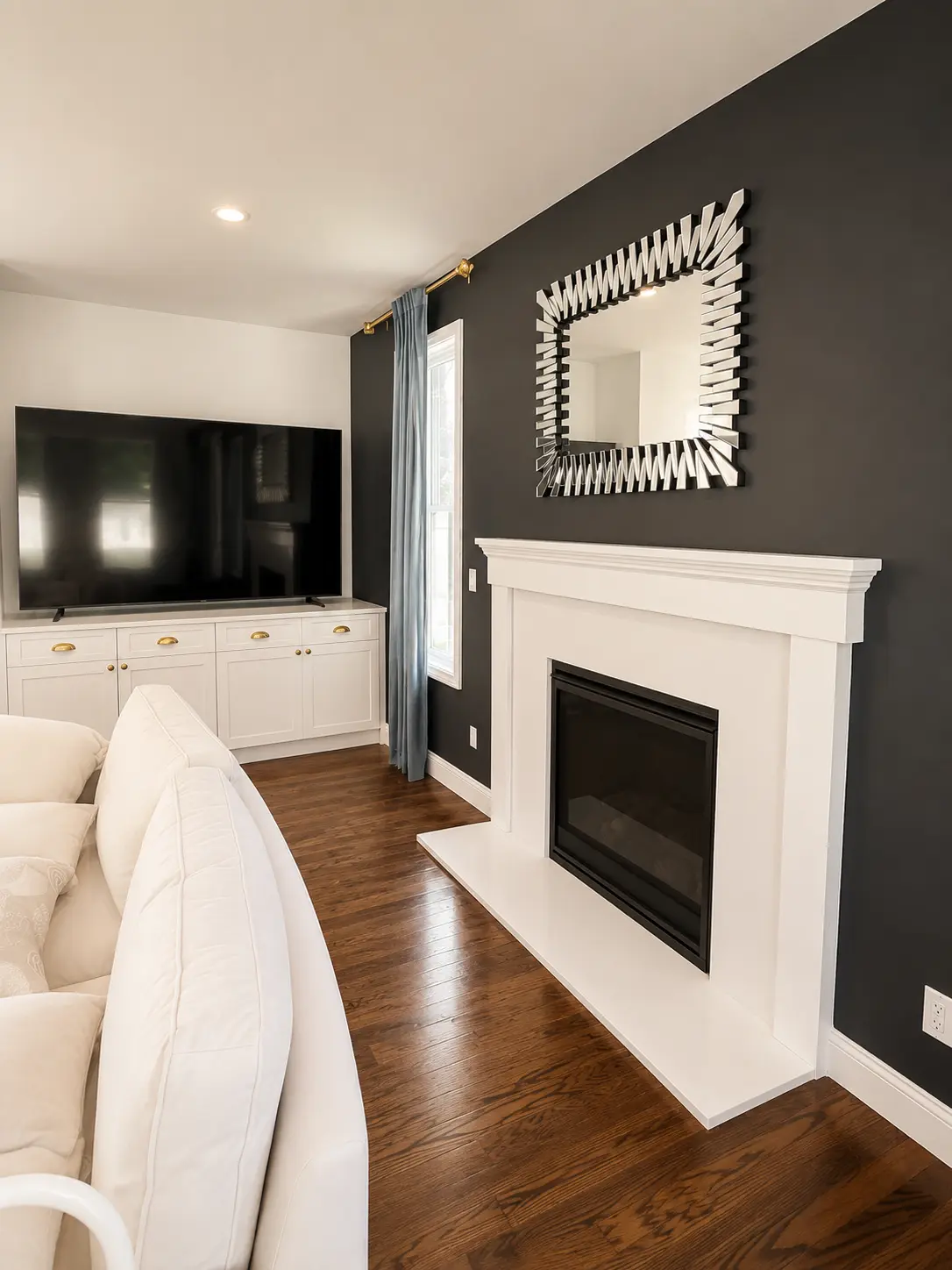 Freshly painted interior hallway with clean white trim, smooth walls in a warm greige, and light coming through an open doorway.